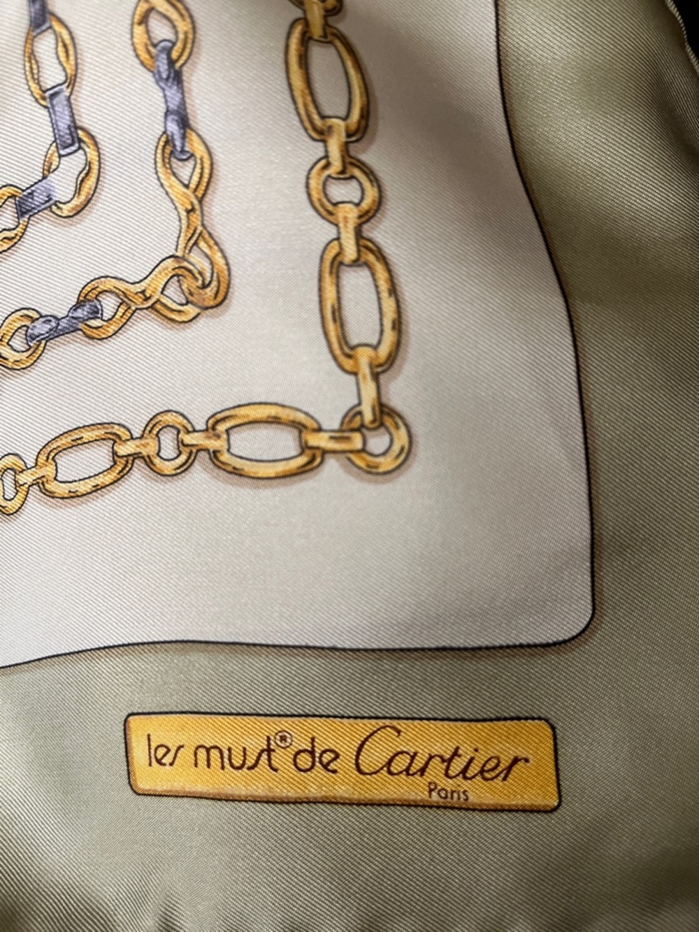 Cartier silk scarf in olive green with gold chain print